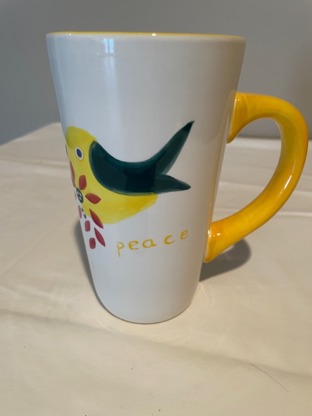 Baum White Ceramic Peace Mug with Yellow Handle and Bird Design